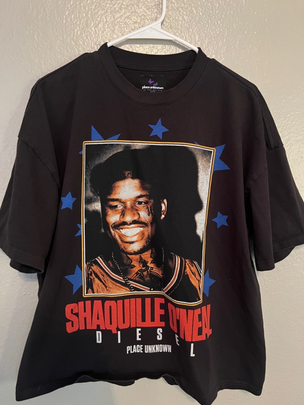 Place Unknown Black Graphic Tee Featuring Red and Blue Accents